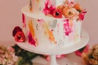 93 a super bright two-tier wedding cake with bold watercolors, speckles and bright blooms is a great idea for a summer wedding