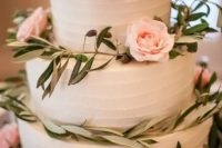 94 a tender white buttercream wedding cake decorated with greenery and blush roses is a beautiful idea for a spring or summer wedding