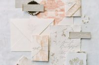 a beautiful neutral and pastel wedding invitation suit with a raw edge, muted color prints and seashells