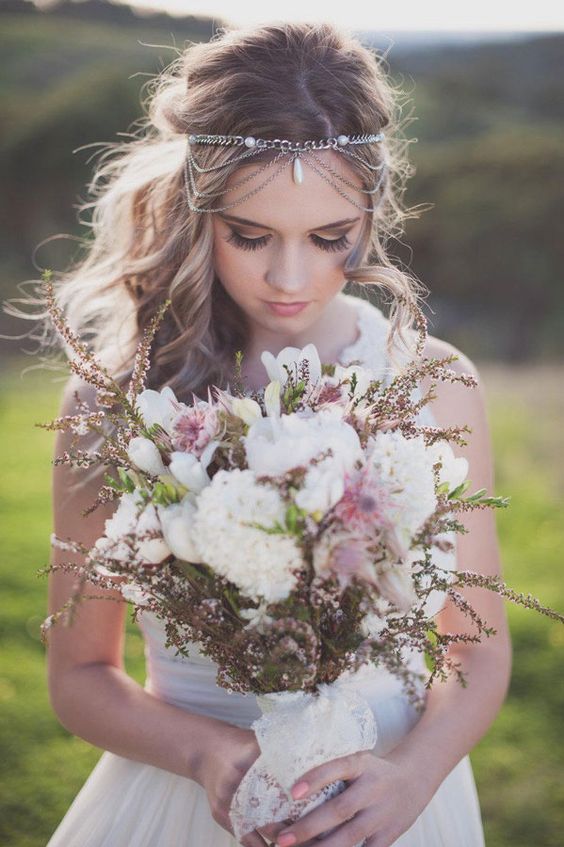 a boho chain headpiece with pearls and some layers bring an instant boho feel