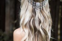 a boho chic wavy wedding hairstyle with silver jewel draped headpiece to highlight it