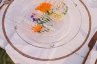 a bright pressed flower acrylic wedding menu is a great idea for a colorful and natural touch to the space