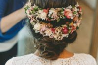 a cool fresh flower halo hairpiece of two parts highlights the romantic low updo