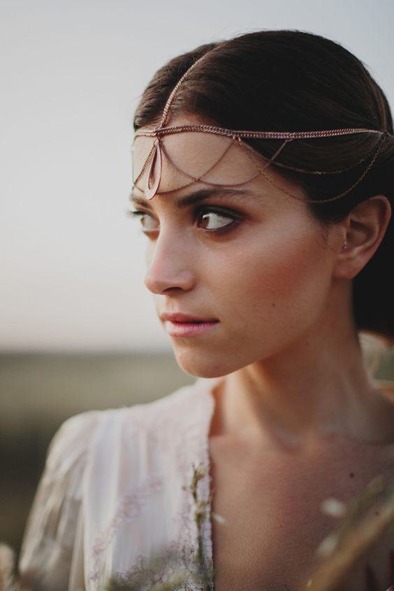 a delicate rose gold chain headpiece with layers and a central pendant looks unique