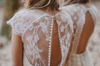 a dreamy boho A-line wedding dress of lace, with buttons and cap sleeves plus a high neckline is a fantastic solution