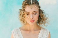 a gold chain and rhinestone headpiece will give a slight Moroccan feel to your boho chic bridal look