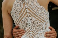 a gorgeous boho lace fitting wedding dress with an illusion racer back done with only leace and pearls is a fantastic idea