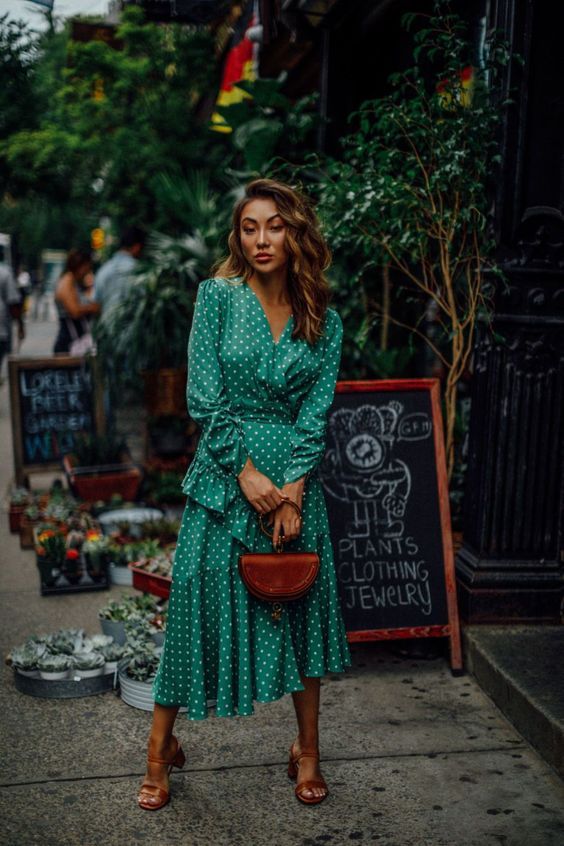 a green polka dot wrap midi dress with long sleeves, brown square toe shoes and a brown bracelet bag for the fall