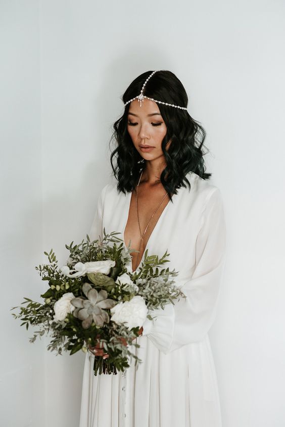 a jeweled boho chain headpiece with pearls and rhinestones for a free-spirited bride