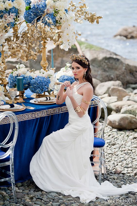 a white draped one shoulder wedding dress is simple yet it gives you a look of a Greek goddess