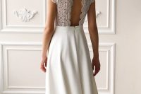 an A-line wedding dress with a boho lace bodice and a plain skirt with a train, a cutout back of boho lace is amazing
