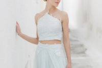 an embellished lace minty green wedding separate with a halter neckline and a flowy skirt looks very edgy