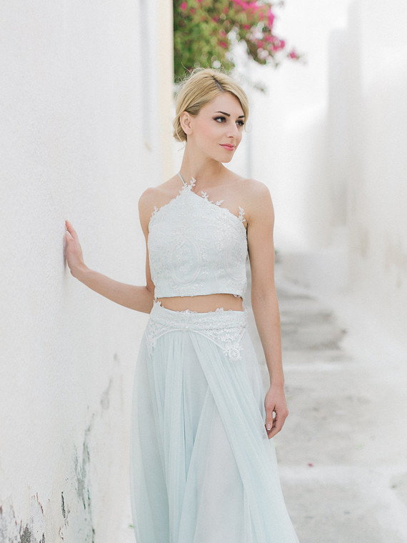 an embellished lace minty green wedding separate with a halter neckline and a flowy skirt looks very edgy