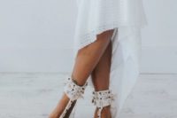 catchy macrame and seashell barefoot wedding sandals are amazing for a boho beach bride