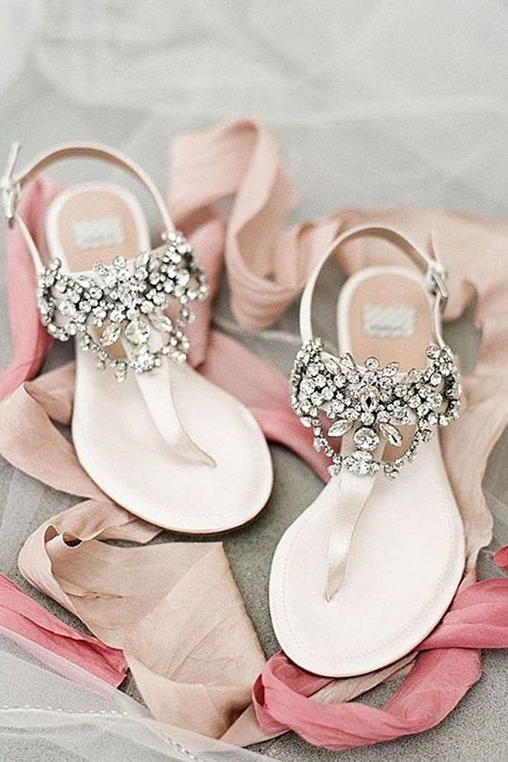 heavily embellished flat wedding sandals look chic, bright, shiny and bold and will be a nice option