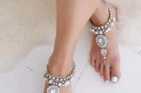 heavily embellished gold chain and crystals barefoot wedding sandals for a boho or gypsy beach bride