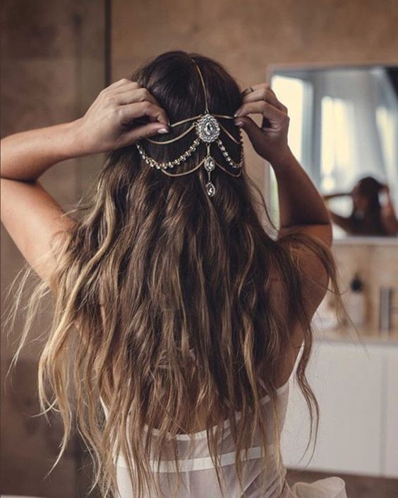 long waves down accented with a jeweled chain that looks boho and a bit gypsy-like