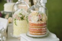 place your wedding cakes into cloches to keep them safe from any bugs outdoors and highlight them