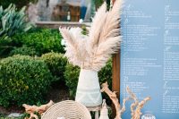 stunning beach decor in boho style, with pampas grass, succulents, driftwood, woven touches and candles