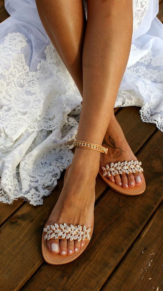 tan leather ankle strap heavily embellished wedding sandals are a nice and bold idea for a beach bride