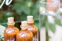 your homemade BBQ sauce in bottles is a perfect favor idea for a BBQ or rustic wedding