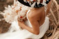 a boho bridal look with a hat
