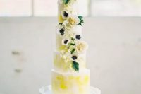 a bright spring five tier wedding cake with bold yellow touches, neutral blooms and leaves is a real masterpiece