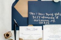 a chic navy and gold weddding invitation suite with calligraphy