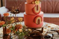 a coral wedding cake with bright blooms and bold geometric detailing is a lvoely idea for a colorful 70s wedding with a boho feel