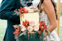 a fantastic white and teal wedding cake with copper drizzle, obre macarons and blush and rust-colored blooms