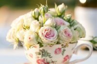 a floral vintage teacup with fresh pink blooms is a gorgeous wedding favor and escort card holder