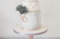 a grey marble and white wedding cake with sugar succulents, copper hexagons and shards is a stylish idea for a modern wedding