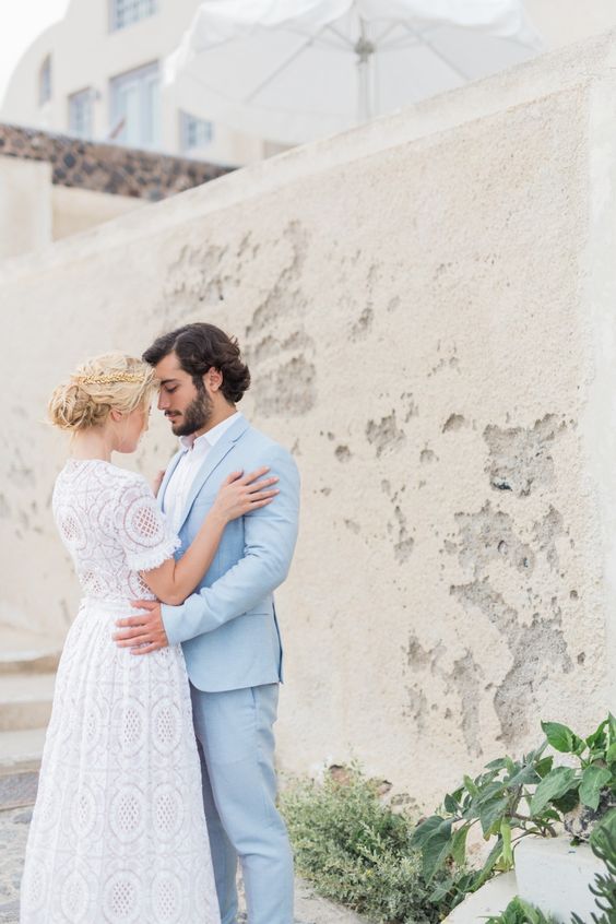 a powder blue groom's suit and a white shirt for a coastal or beach look