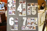 a stylish and simple wedding seating chart with large numbers and your guests’ Polaroids