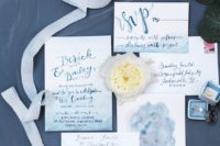 a unique wedding invitation suite with blue ombre, blue calligraphy is perfect for a beach or coastla wedding