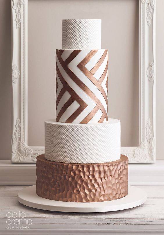 a white and copper wedding cake with textural tiers, with a geometric one is a stylish and refined idea for a modern wedding