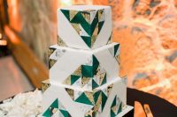 a white square wedding cake with gold, grey marble and emerald triangles covering it is a chic and cool idea to rock