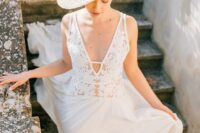 a wide-brim straw bridal hat with white dried blooms on top is a lovely idea for a bride inspired by vintage