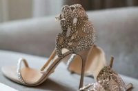 beautiful neutral embellished and laser cut bridal heels with just one strap on the top are amazing for a spring or summer bride