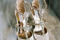 creamy strappy heavily embellished wedding shoes are a bold and shiny option that will fit most of bridal looks