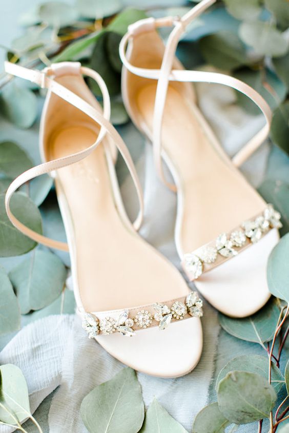 delicate creamy low heel wedding shoes with floral rhinestones and leaves plus straps are amazing for a spring or summer bridal look