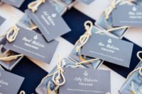 mini anchor escort cards with rope and tags with names will double as nice nautical wedding favors