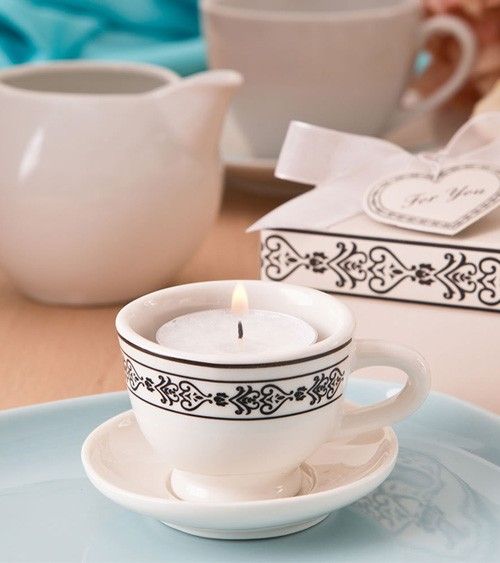 place some tealights into your vintage teacups to make them cooler favors and add escort cards to them
