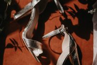 silver block heel ankle strap wedding shoes are a veyr actual and chic idea for any bridal look, this is classics