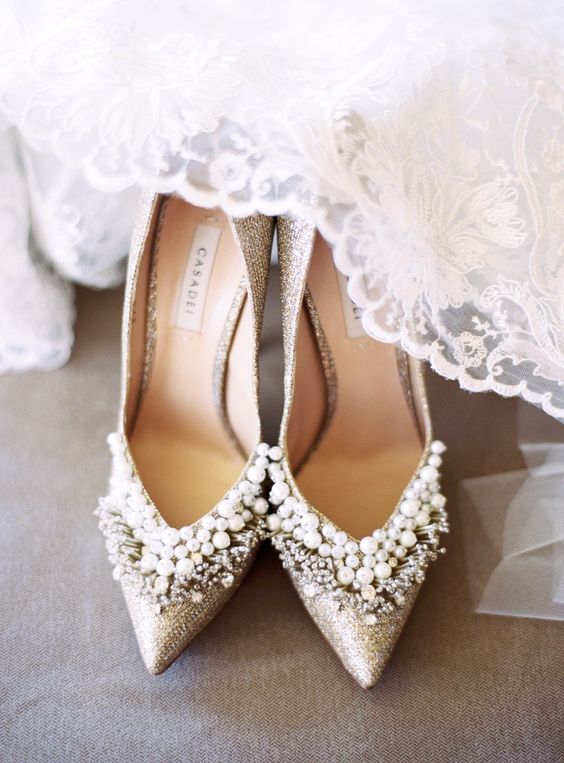 silver glitter and heavily embellished wedding shoes with rhinestones and pearls are a gorgeous solution to rock for a super glam touch