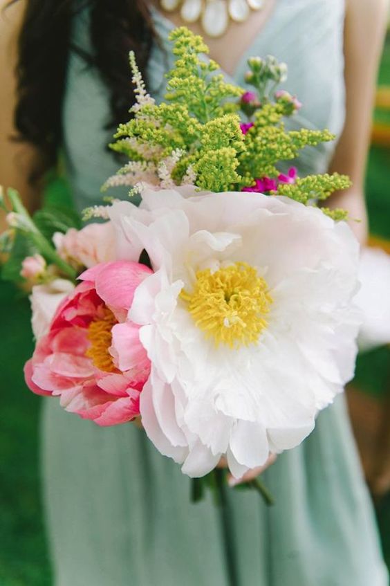 a beautiful wedding bouquet of oversized pink and white blooms and greenery is a lovely idea for spring and summer