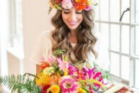 a bold wedding bouquet of hot pink, yellow, orange, red blooms including pincushion proteas, greenery for a tropical bride