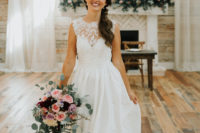 a chic and romantic barn wedding dress with no sleeves, a lace bodice and a full skirt with a train