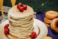 a classy pancake wedding cake topped with strawberries is a perfect idea for a summer or spring brunch wedding