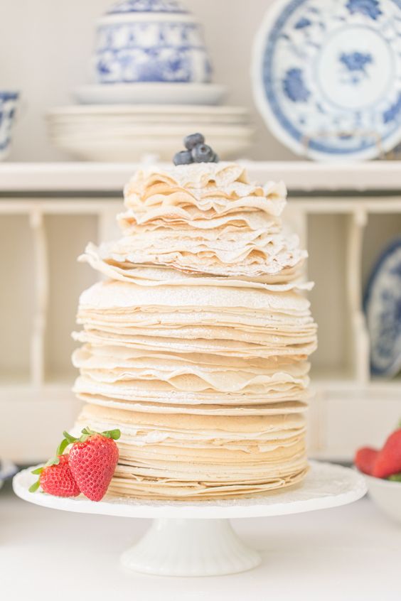 a crepe wedding cake topped with fresh berries is always a good idea for most weddings, make it yourself